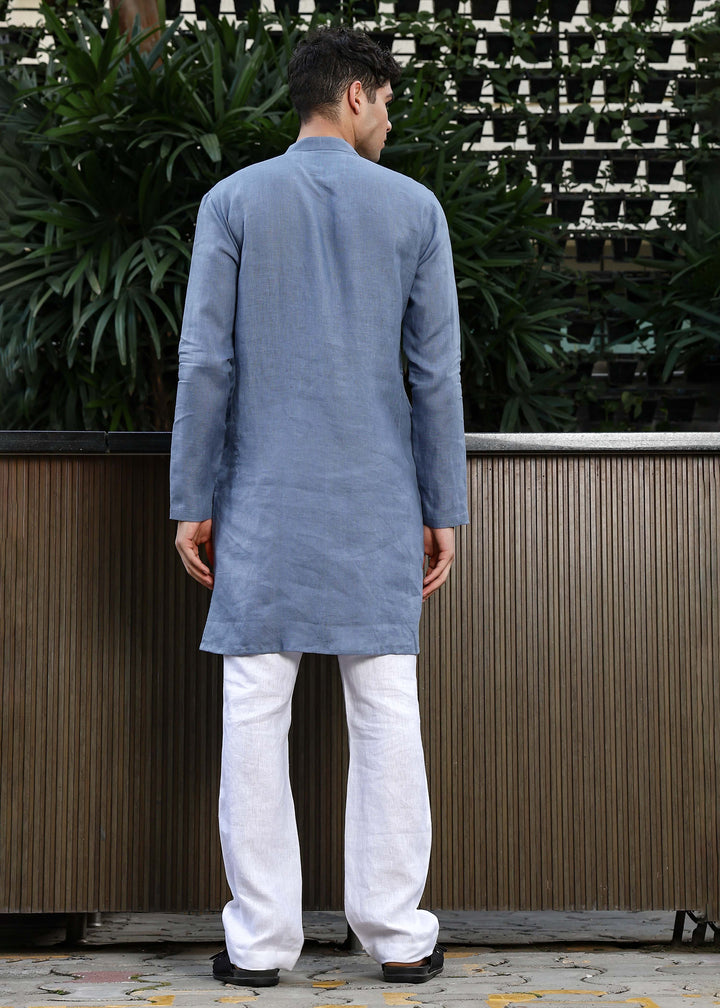 Man wearing Blue Grey Kurta, 100% pure linen, outdoor green background.