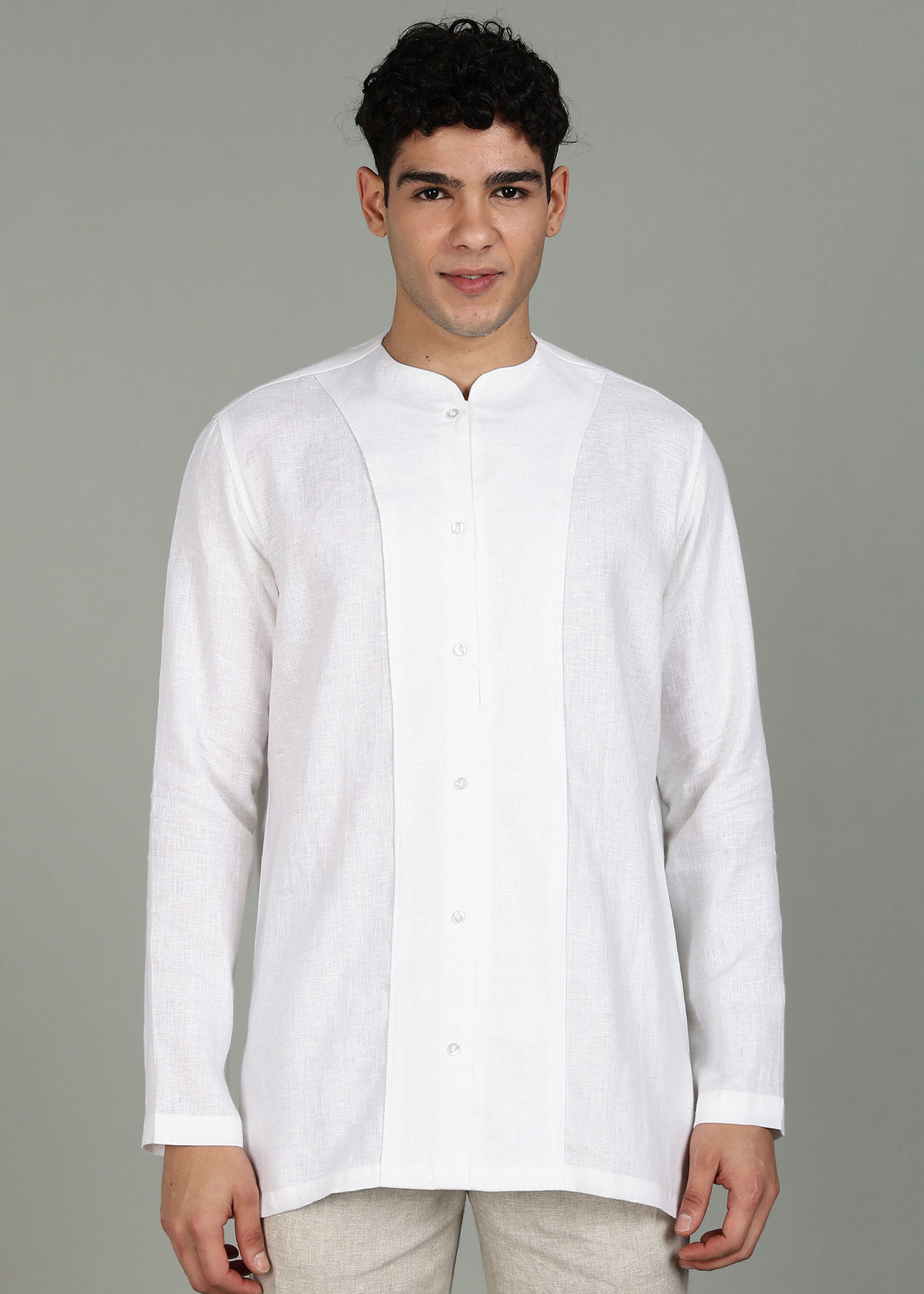 Man wearing a 100% pure linen white long-sleeve kurta in 44 LEA against a gray background