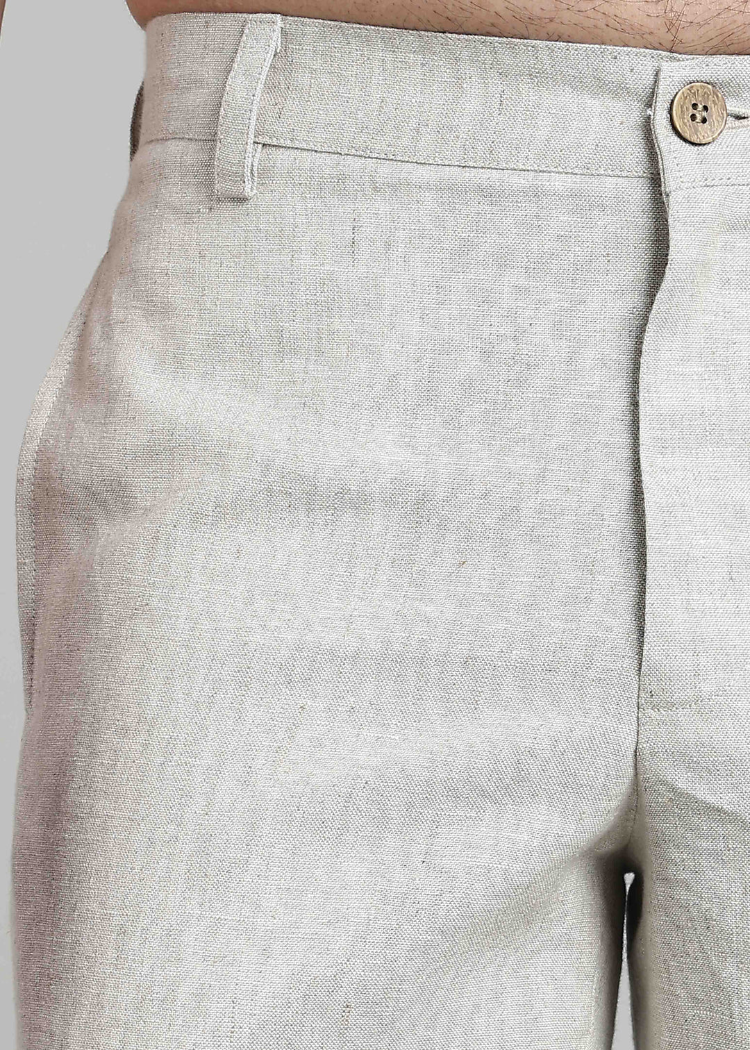 Man wearing 100% pure linen shorts in pure ecru with cossack-green accents in 25 LEA