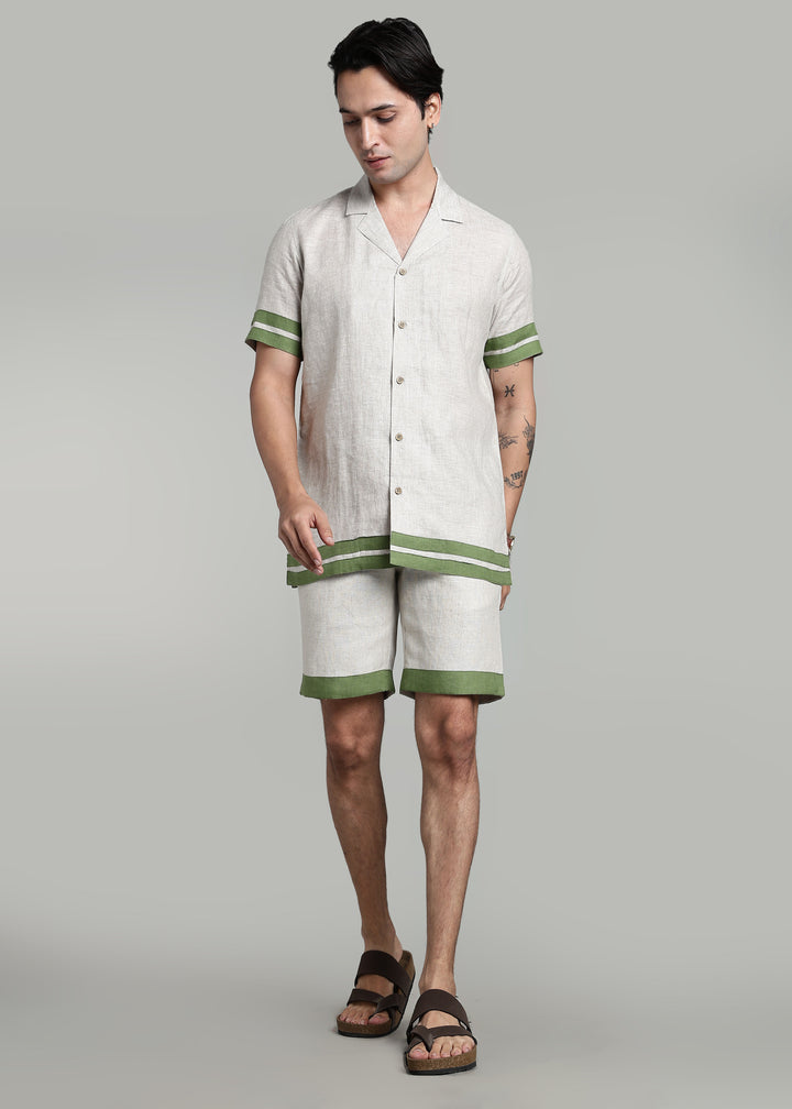 Man wearing 100% pure linen shorts in pure ecru with cossack-green accents in 25 LEA