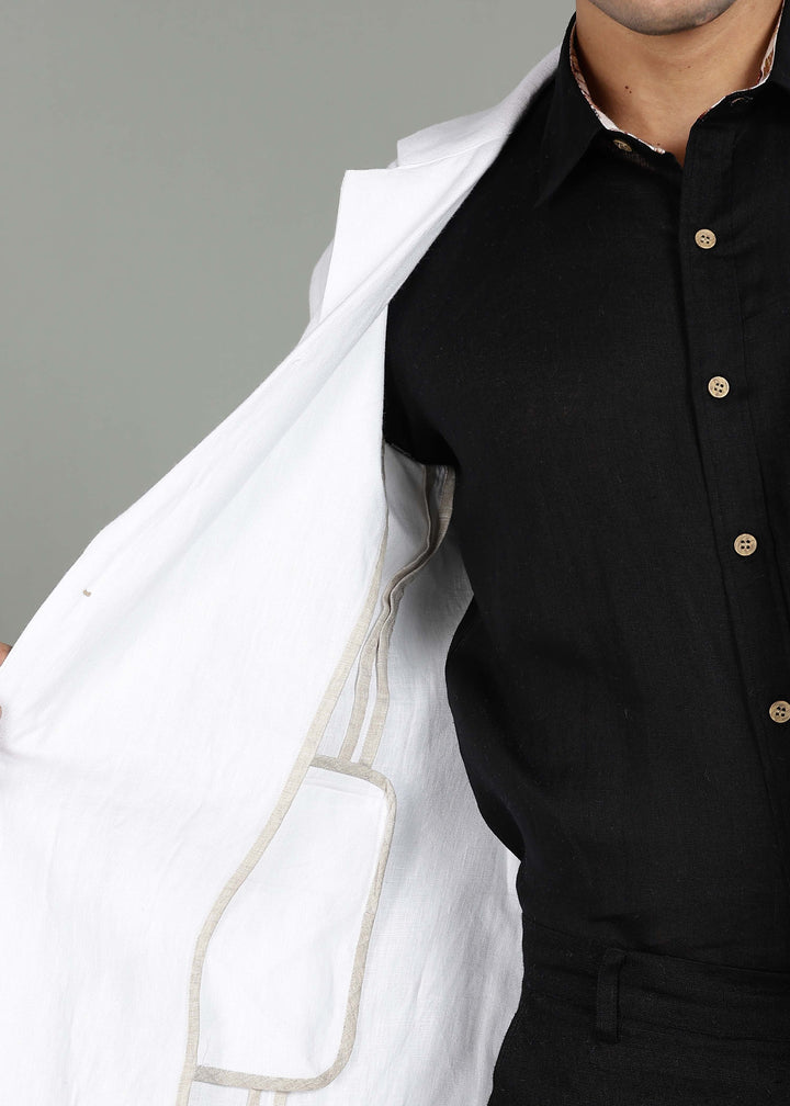 Man wearing a 100% pure linen white Jacket in 25 LEA over a black shirt on a gray background