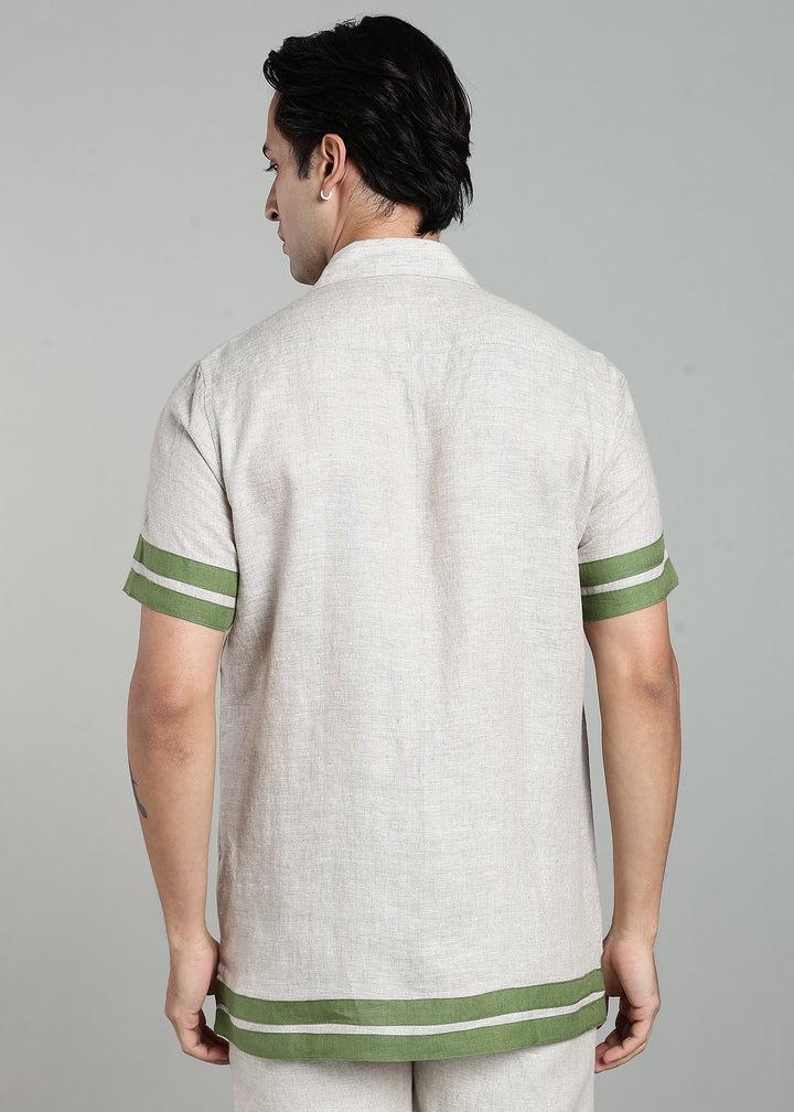 Man wearing 100% pure linen cuban-collar shirt and shorts in pure ecru with cossack-green accents in 60 LEA(shirt) & 25 LEA(shorts)