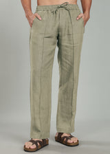 Person wearing 100% pure linen artichoke green pants on a gray background