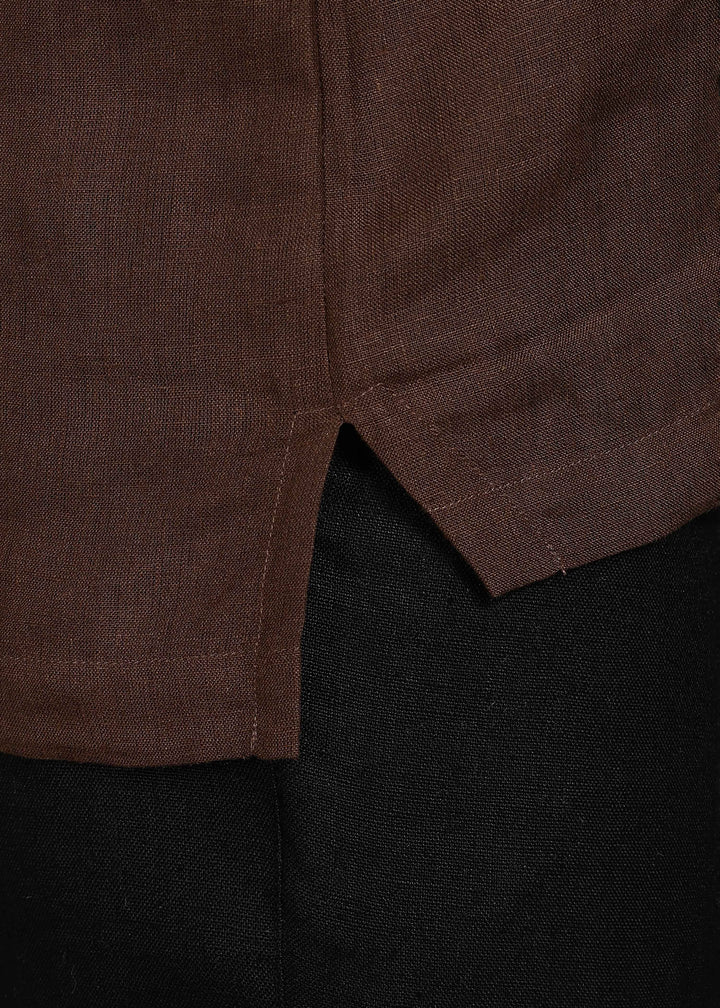 Man wearing 100% 60 LEA Linen Coffee brown T - Shirt in an indoor grey background.