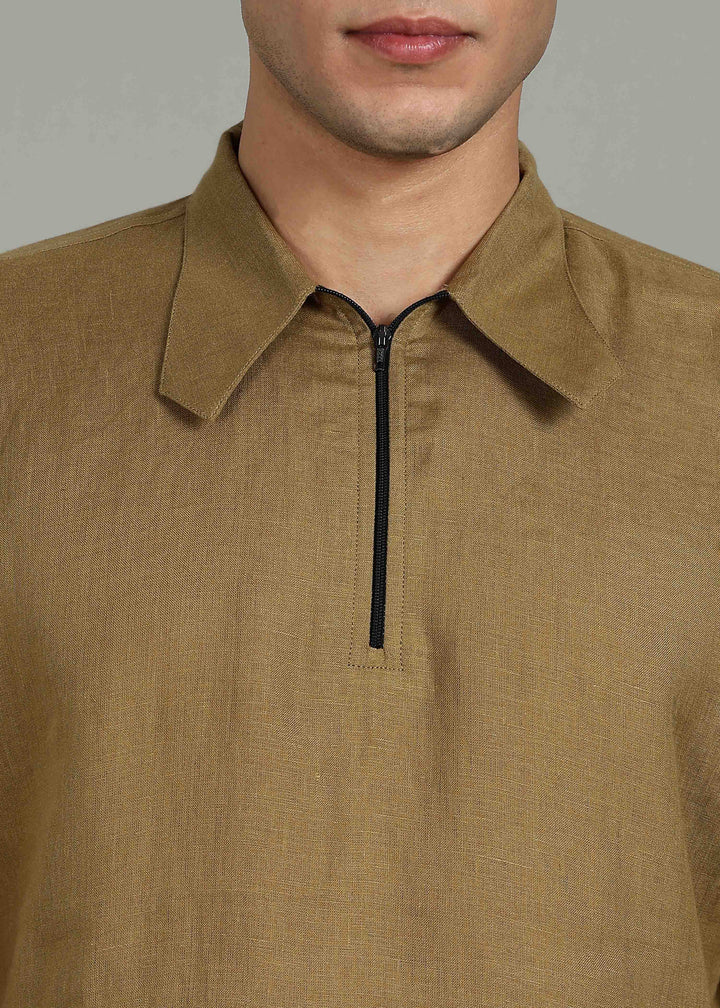 Man wearing 100% 60 LEA Linen Golden Olive Green T - Shirt in an indoor grey background.