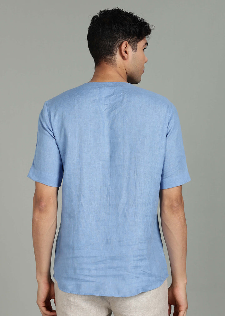 Man wearing 100% 60 LEA Olympic Blue Mandarin collar  T - Shirt in an indoor grey background.
