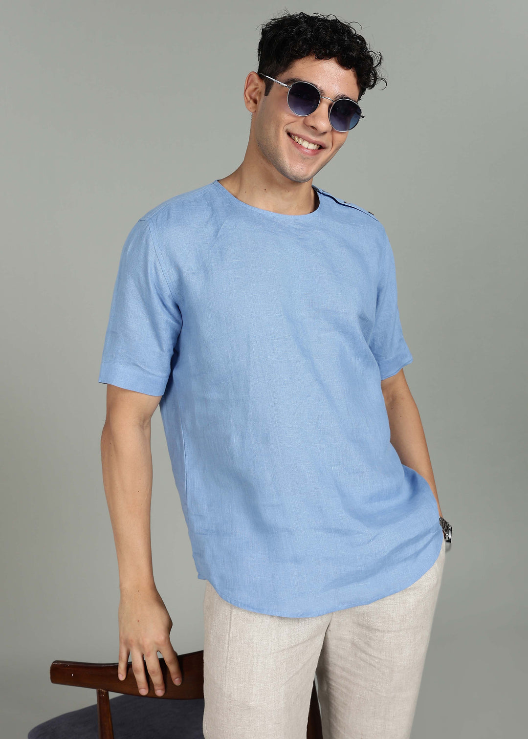 Man wearing 100% 60 LEA Olympic Blue Mandarin collar  T - Shirt in an indoor grey background.
