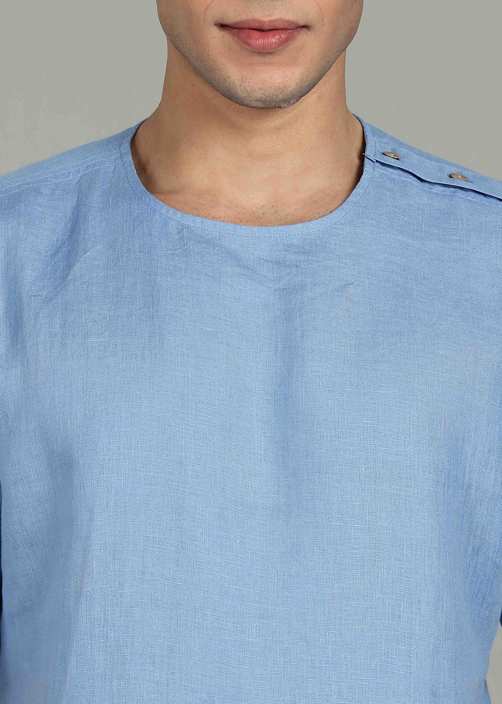 Man wearing 100% 60 LEA Olympic Blue Mandarin collar  T - Shirt in an indoor grey background.