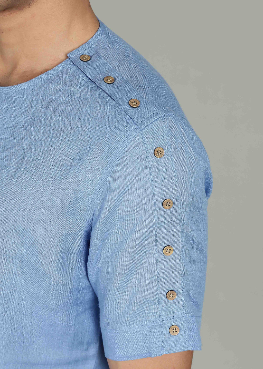 Man wearing 100% 60 LEA Olympic Blue Mandarin collar  T - Shirt in an indoor grey background.