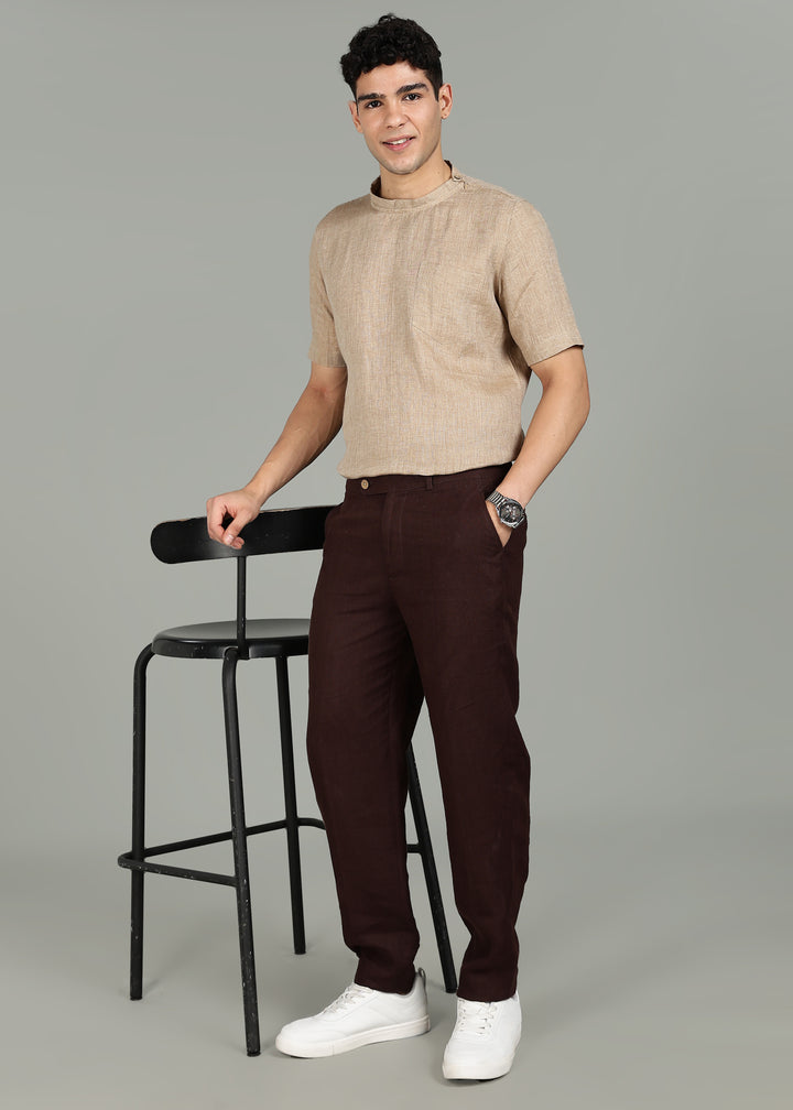 Man wearing 100% 60 LEA Mocha Mandarin collar  T - Shirt in an indoor grey background.
