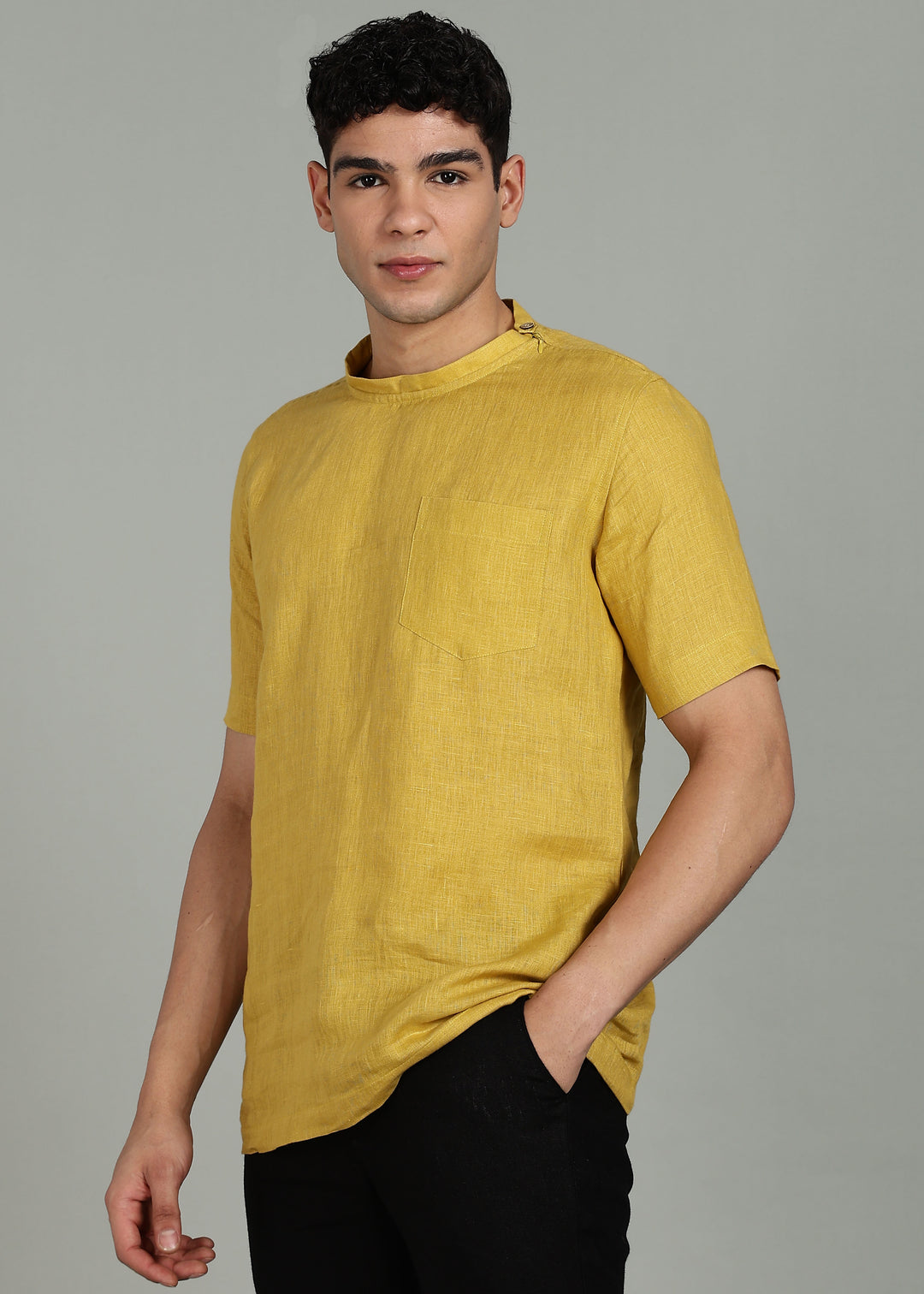 Man wearing 100% 60 LEA Sun Burst Yellow Mandarin collar  T - Shirt in an indoor grey background.