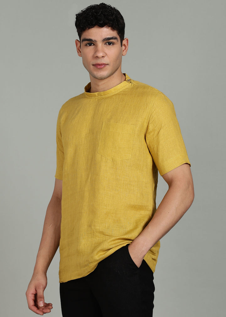 Man wearing 100% 60 LEA Sun Burst Yellow Mandarin collar  T - Shirt in an indoor grey background.