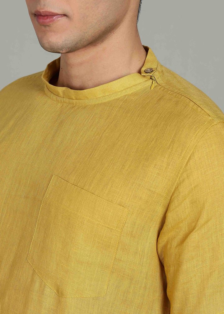 Man wearing 100% 60 LEA Sun Burst Yellow Mandarin collar  T - Shirt in an indoor grey background.