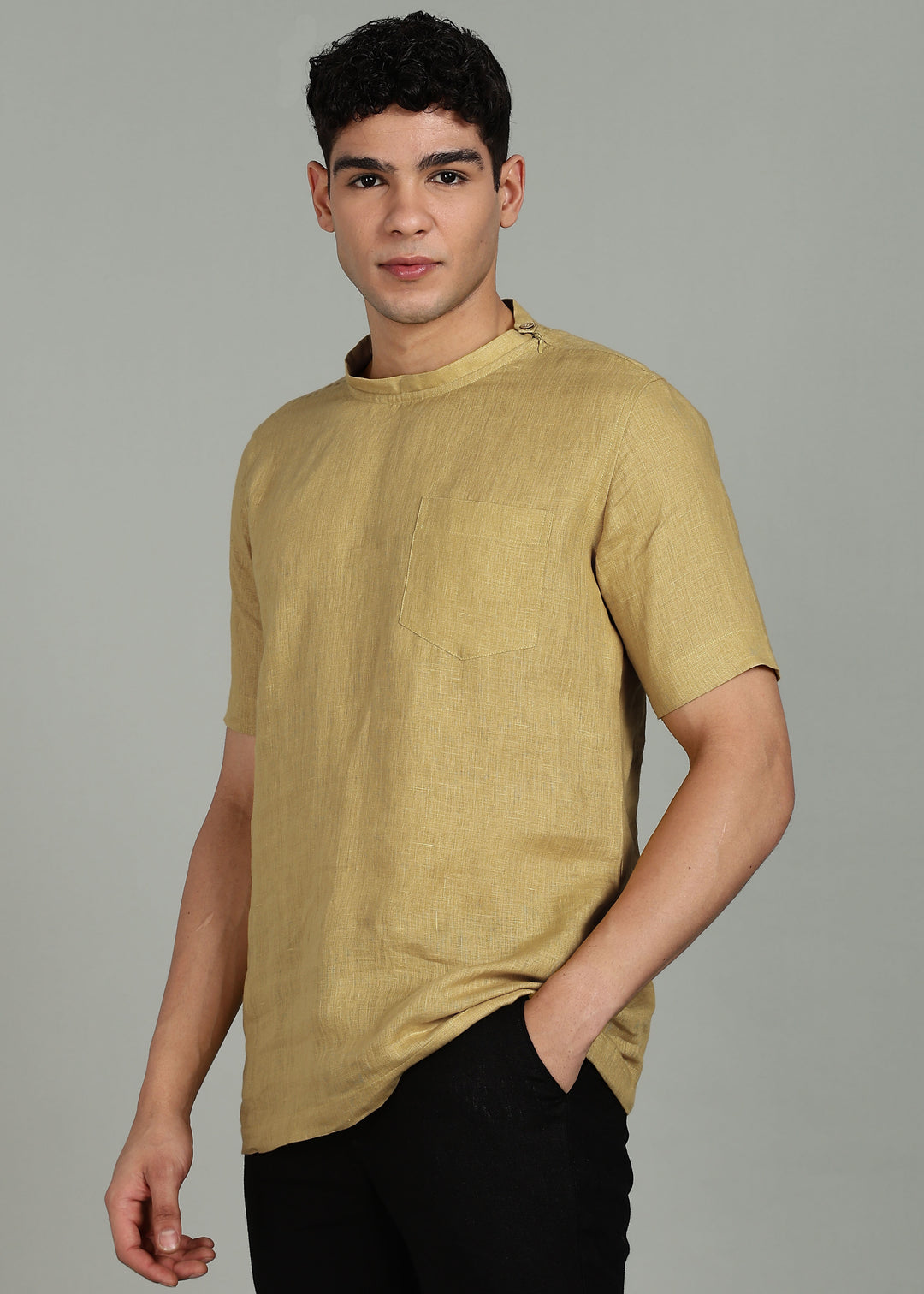 Man wearing 100% 60 LEA Sun Burst Yellow Mandarin collar  T - Shirt in an indoor grey background.