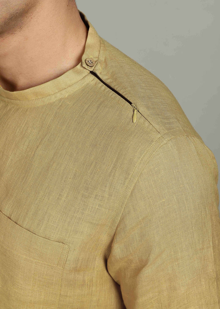 Man wearing 100% 60 LEA Sun Burst Yellow Mandarin collar  T - Shirt in an indoor grey background.