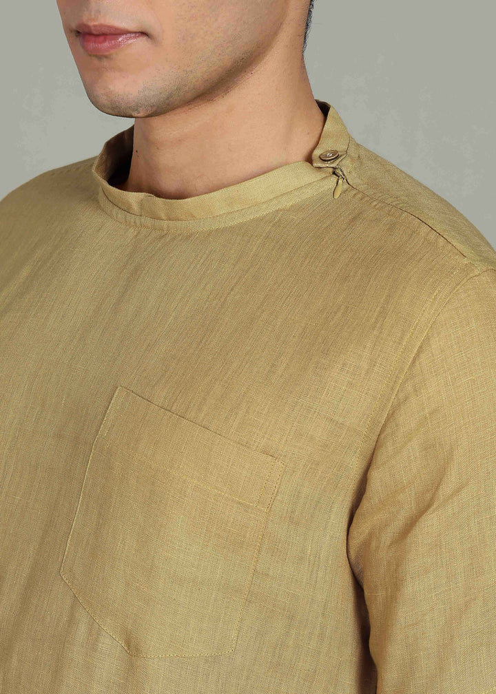 Man wearing 100% 60 LEA Sun Burst Yellow Mandarin collar  T - Shirt in an indoor grey background.