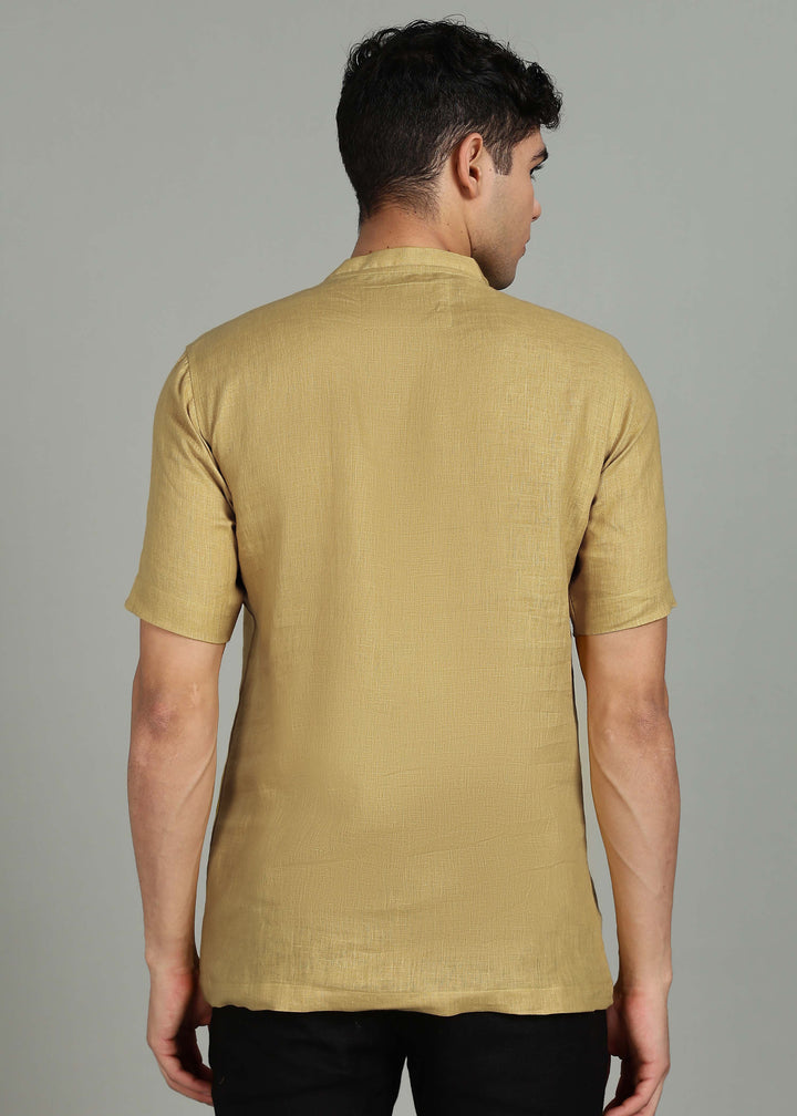 Man wearing 100% 60 LEA Sun Burst Yellow Mandarin collar  T - Shirt in an indoor grey background.