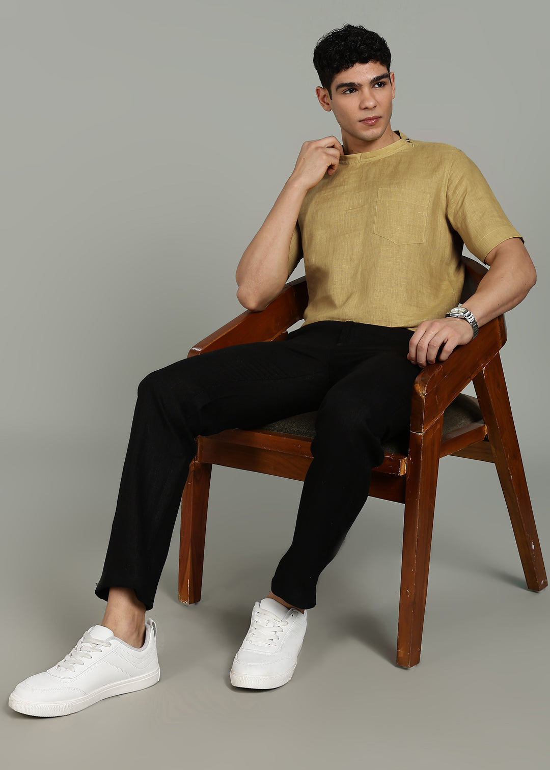 Man wearing 100% 60 LEA Sun Burst Yellow Mandarin collar  T - Shirt in an indoor grey background.