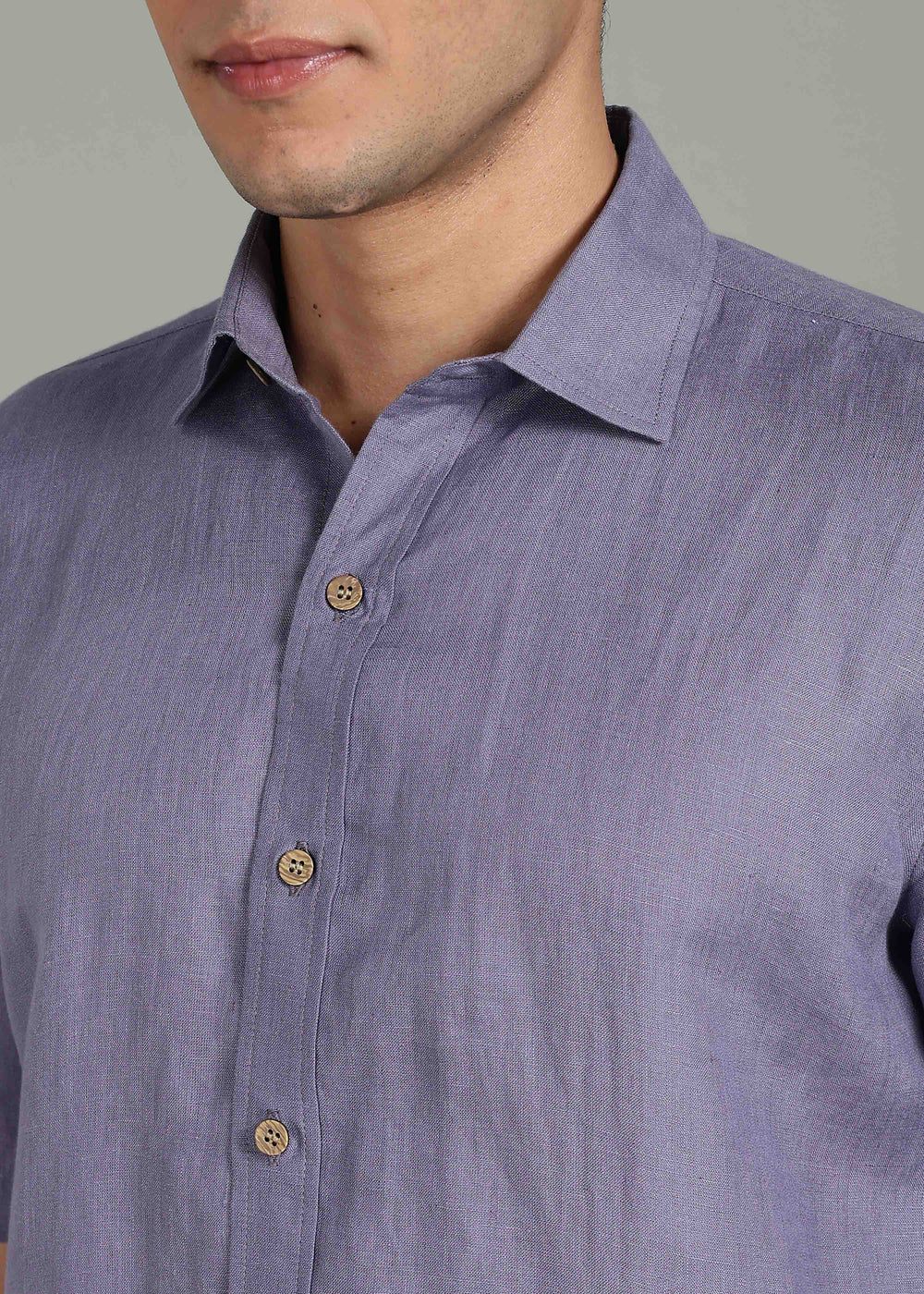 Man wearing 100% 60 LEA Lavender Violet Half sleeve Shirt in an indoor grey background.