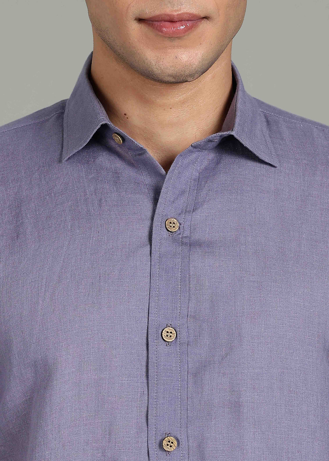 Man wearing 100% 60 LEA Lavender Violet Half sleeve Shirt in an indoor grey background.