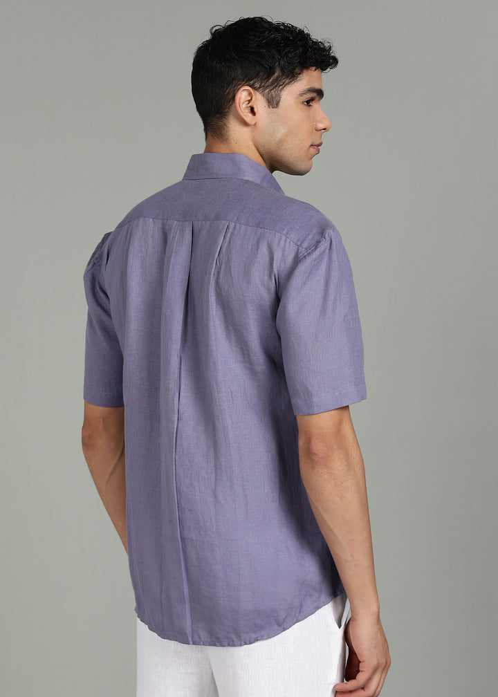 Man wearing 100% 60 LEA Lavender Violet Half sleeve Shirt in an indoor grey background.