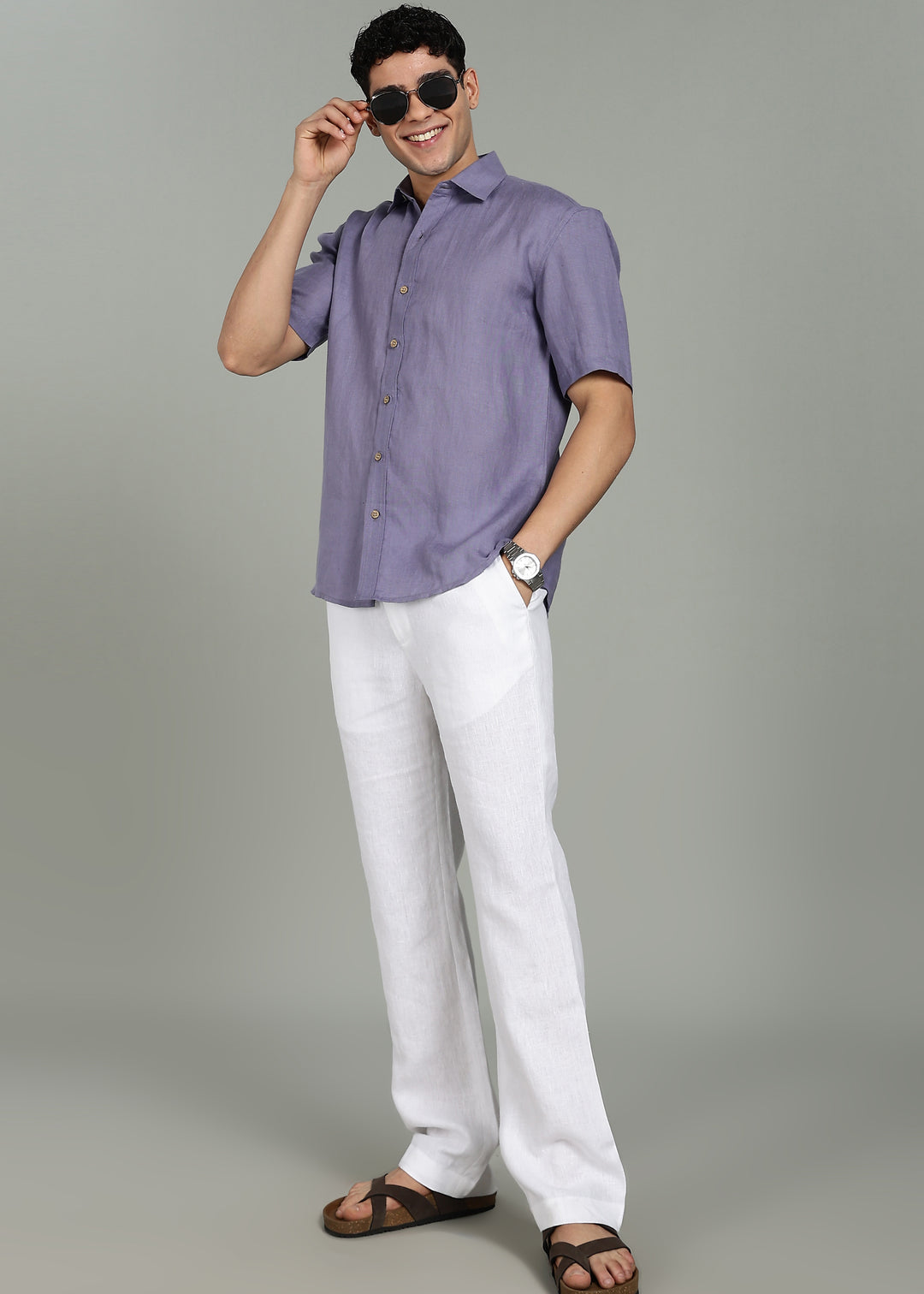 Man wearing 100% 60 LEA Lavender Violet Half sleeve Shirt in an indoor grey background.