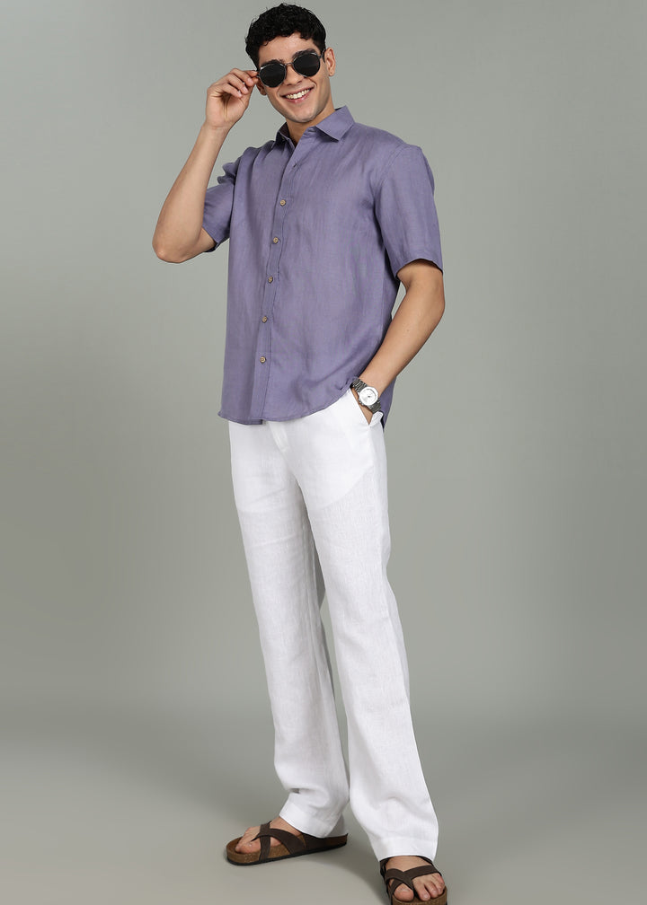 Man wearing 100% 60 LEA Lavender Violet Half sleeve Shirt in an indoor grey background.