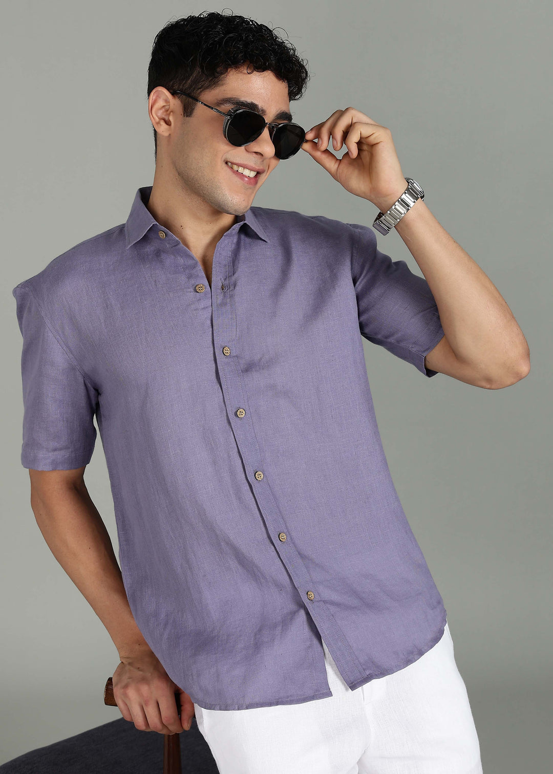 Man wearing 100% 60 LEA Lavender Violet Half sleeve Shirt in an indoor grey background.