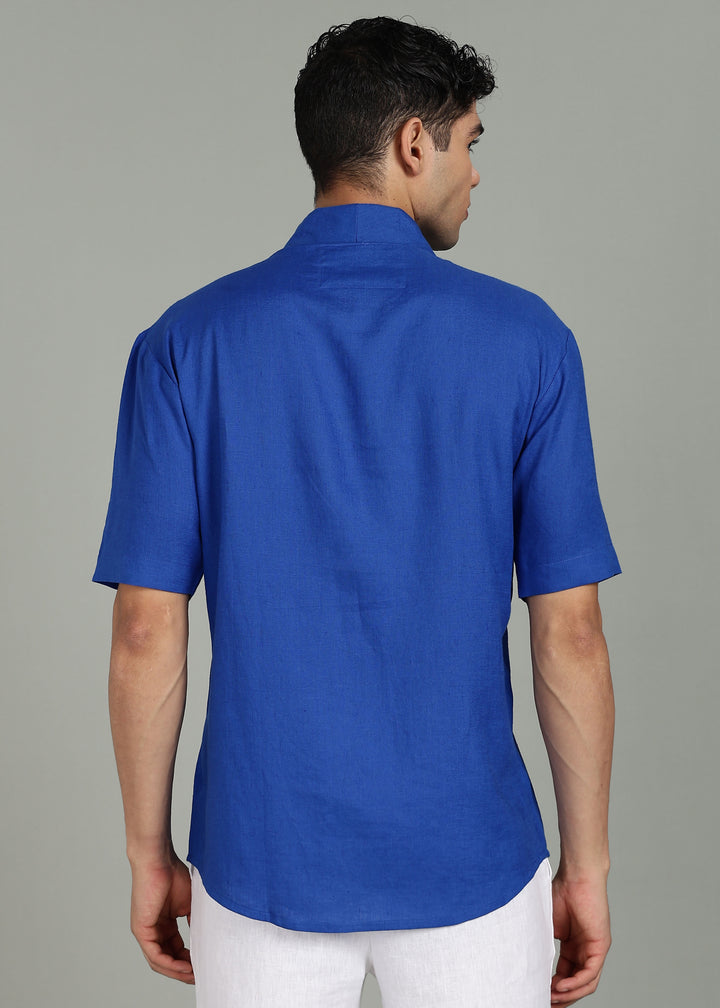 Man wearing 100% 60 LEA Egyptian Blue Shawl collar Half sleeve Shirt in an indoor grey background.