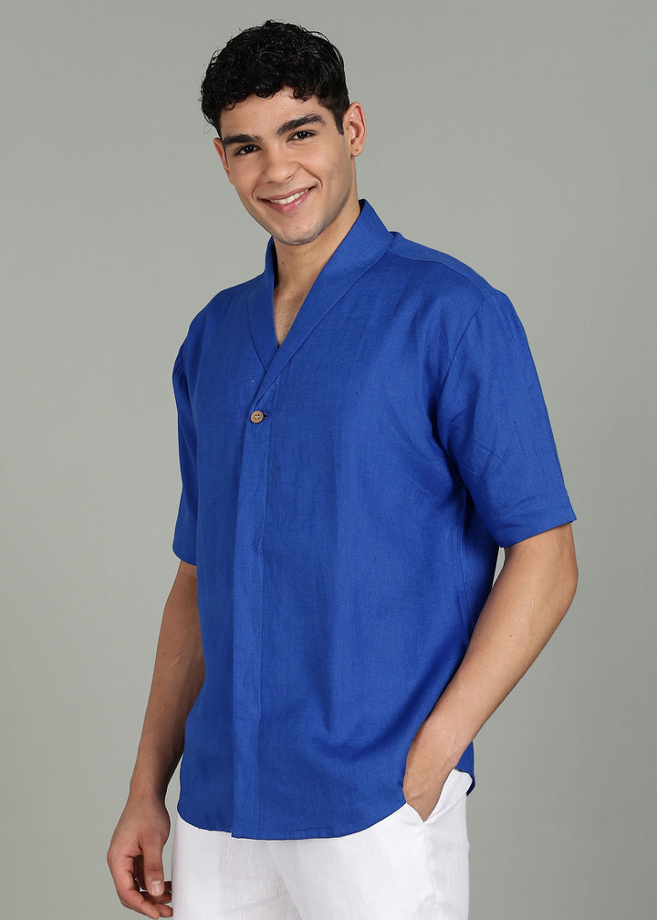 Man wearing 100% 60 LEA Egyptian Blue Shawl collar Half sleeve Shirt in an indoor grey background.