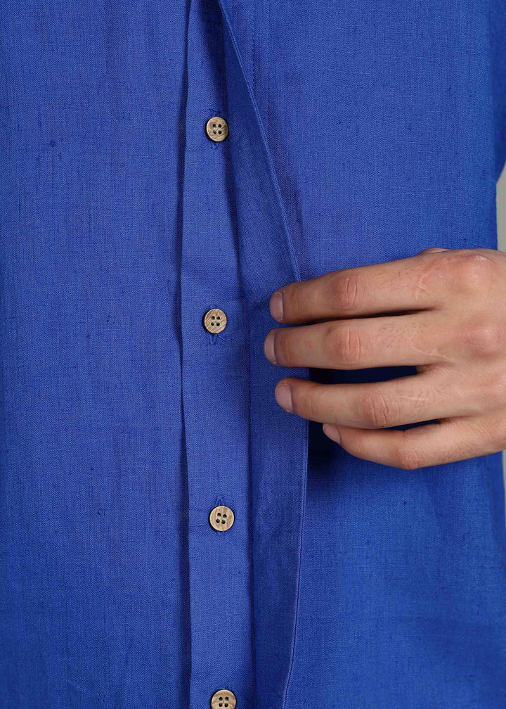 Man wearing 100% 60 LEA Egyptian Blue Shawl collar Half sleeve Shirt in an indoor grey background.