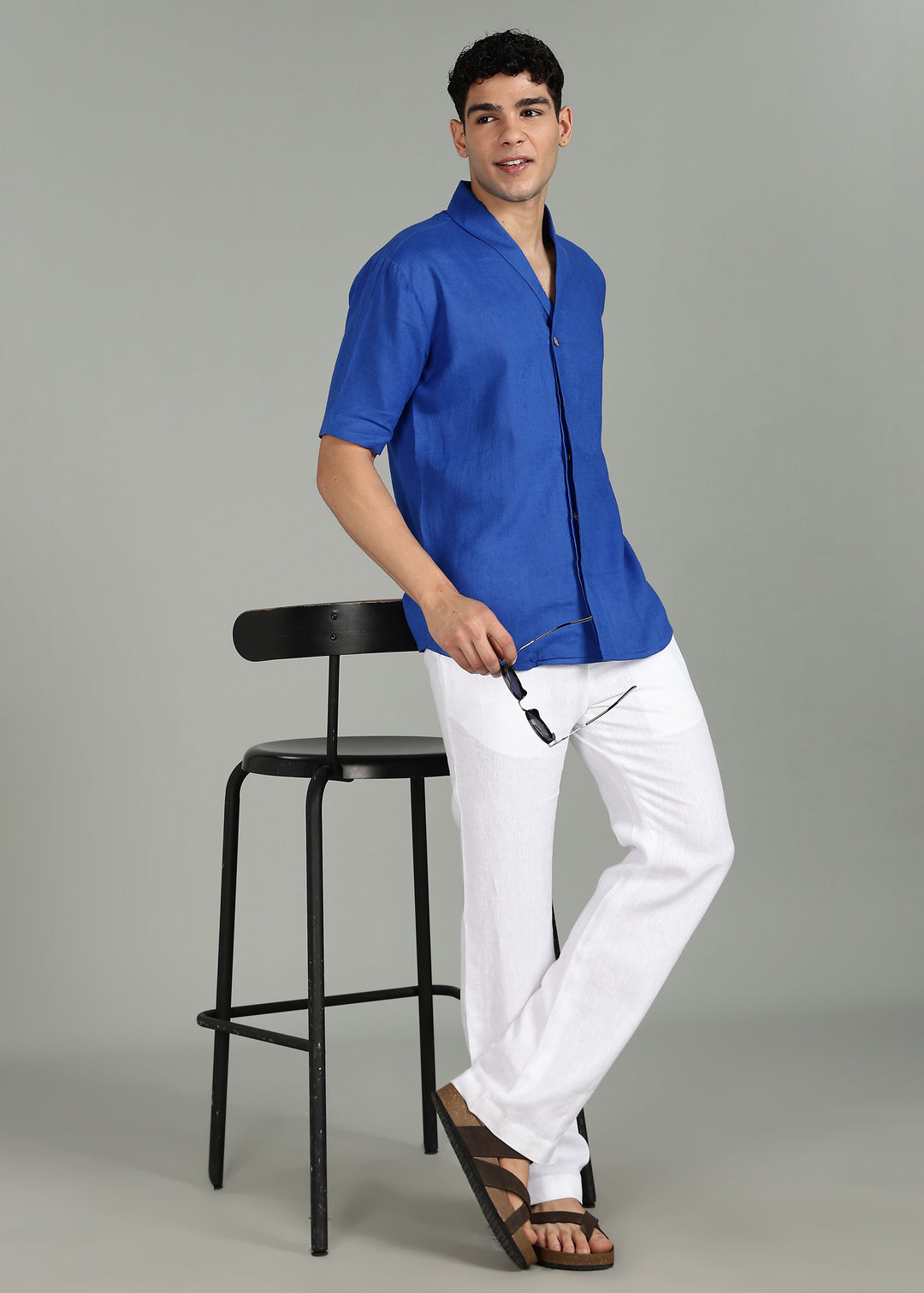 Man wearing 100% 60 LEA Egyptian Blue Shawl collar Half sleeve Shirt in an indoor grey background.