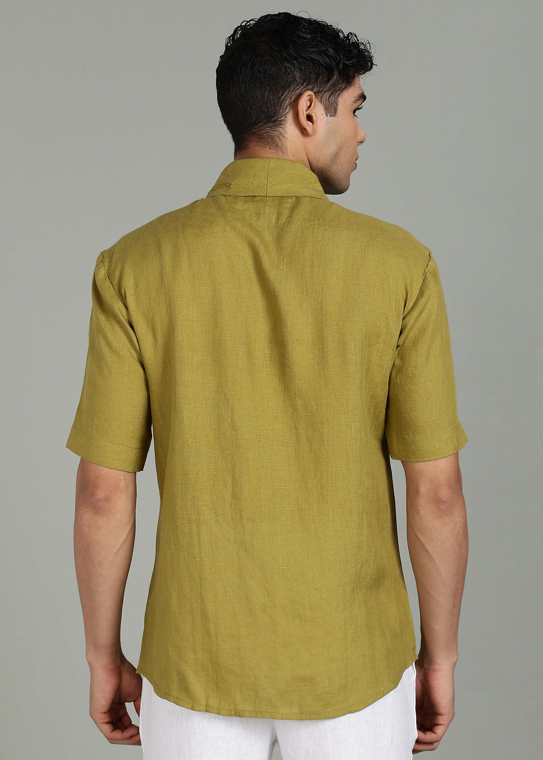 Man wearing 100% 60 LEA Sap Green Shawl collar Half sleeve Shirt in an indoor grey background.