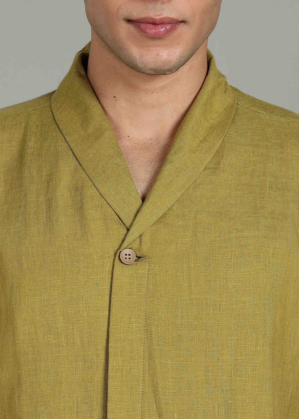 Man wearing 100% 60 LEA Sap Green Shawl collar Half sleeve Shirt in an indoor grey background.