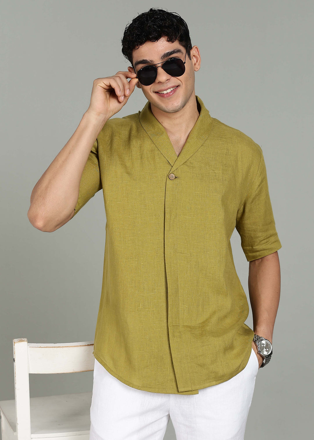 Man wearing 100% 60 LEA Sap Green Shawl collar Half sleeve Shirt in an indoor grey background.