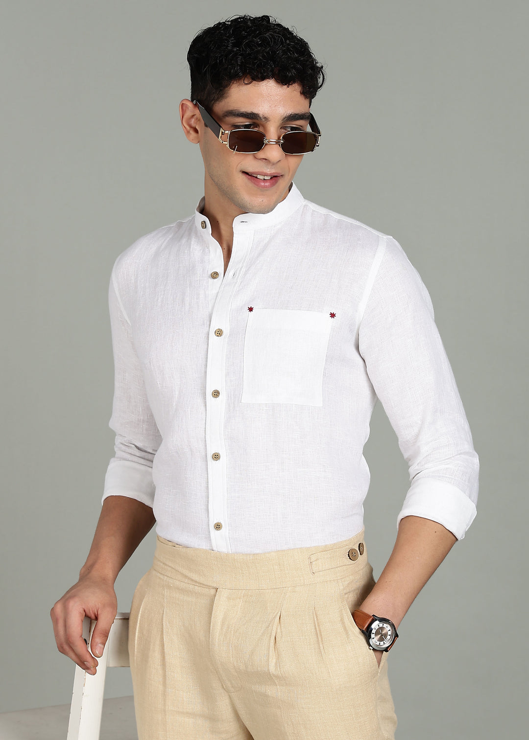 Man wearing a 100% pure linen white full sleeve shirt in 44 LEA with sunglasses on a gray background