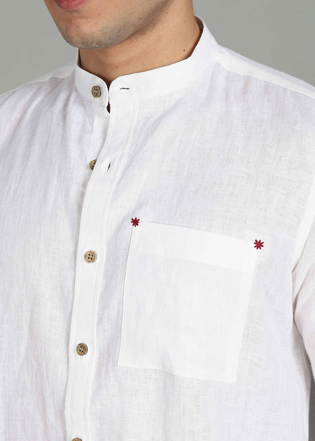 100% pure linen white full sleeve shirt in 44 LEA with red floral embroidery on a gray background