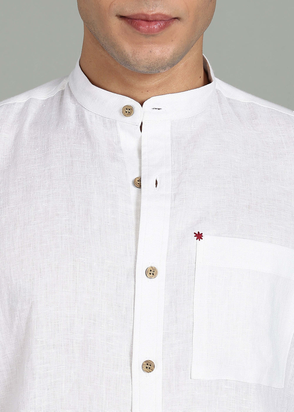 100% pure linen white full sleeve shirt in 44 LEA with a small red star detail on a gray background