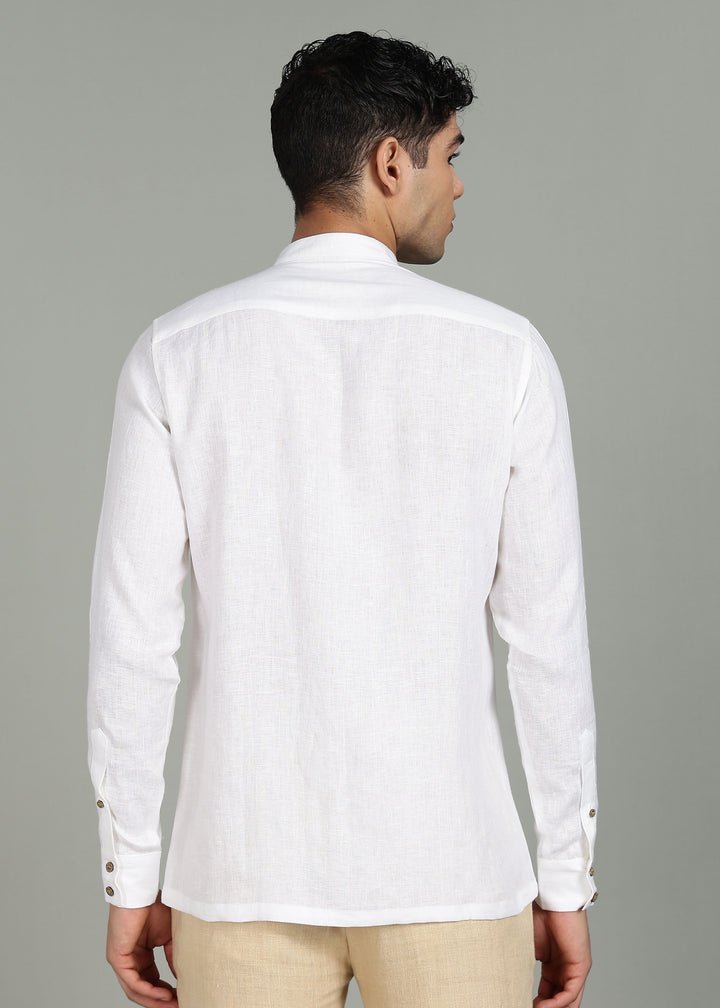 Man wearing a 100% pure linen white full sleeve shirt in 44 LEA with beige pants on a gray background