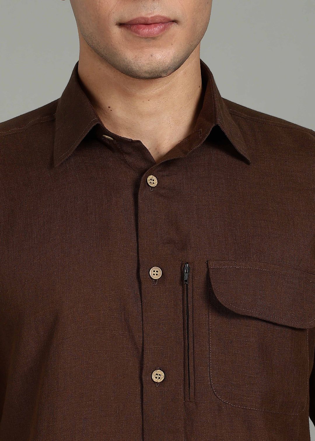 Man wearing 100% 60 LEA Coffee Brown Half sleeve Shirt in an indoor grey background.