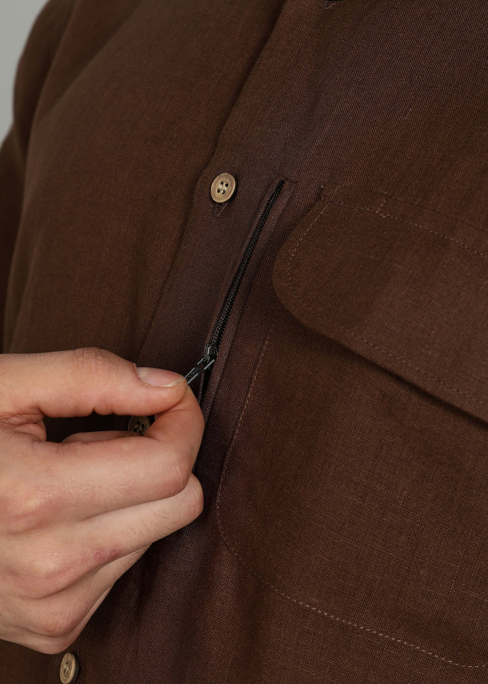 Man wearing 100% 60 LEA Coffee Brown Half sleeve Shirt in an indoor grey background.