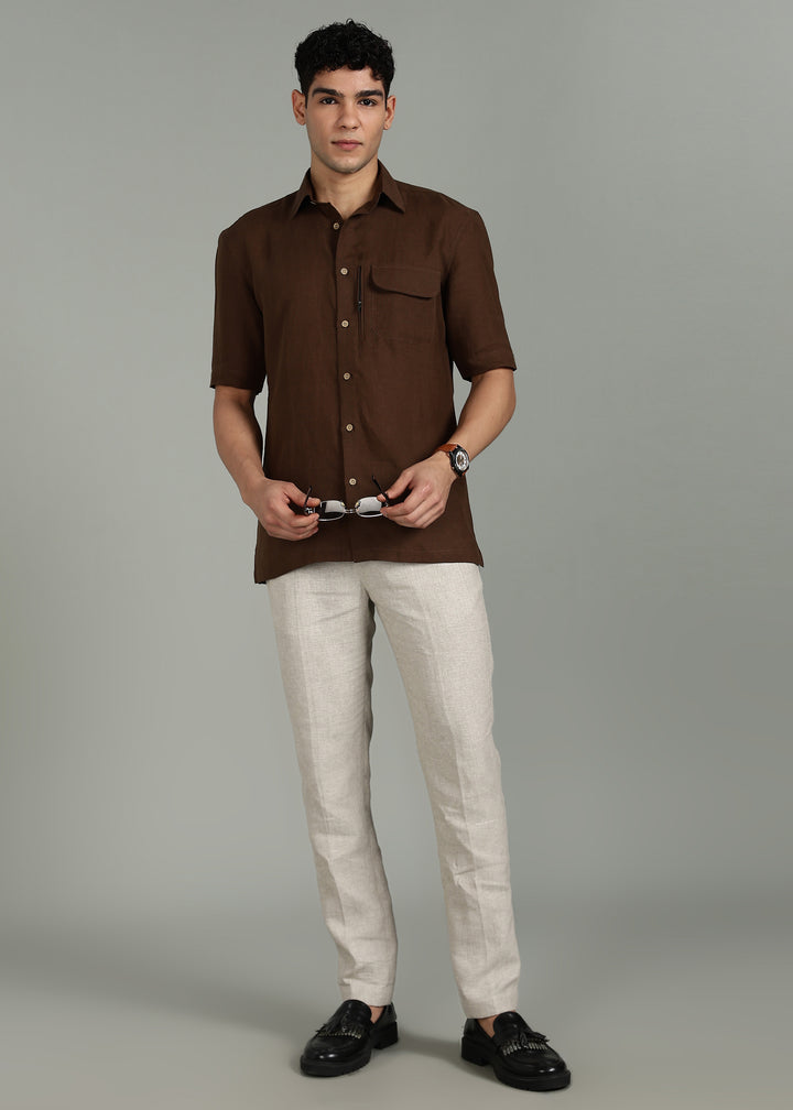 Man wearing 100% 60 LEA Coffee Brown Half sleeve Shirt in an indoor grey background.