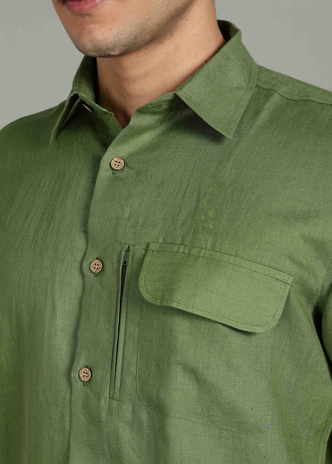 Man wearing 100% 60 LEA Cossack Green Half sleeve Shirt in an indoor grey background.