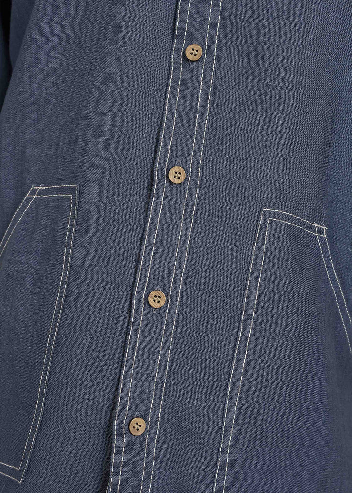 Man wearing 100% 25 LEA Dark Blue Grey Half sleeve Shirt in an indoor grey background.