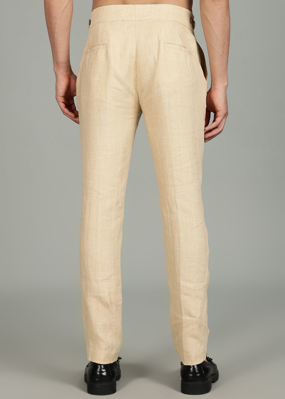 Man wearing 100% 25 LEA Capuccino Beige formal pants in an indoor grey background.