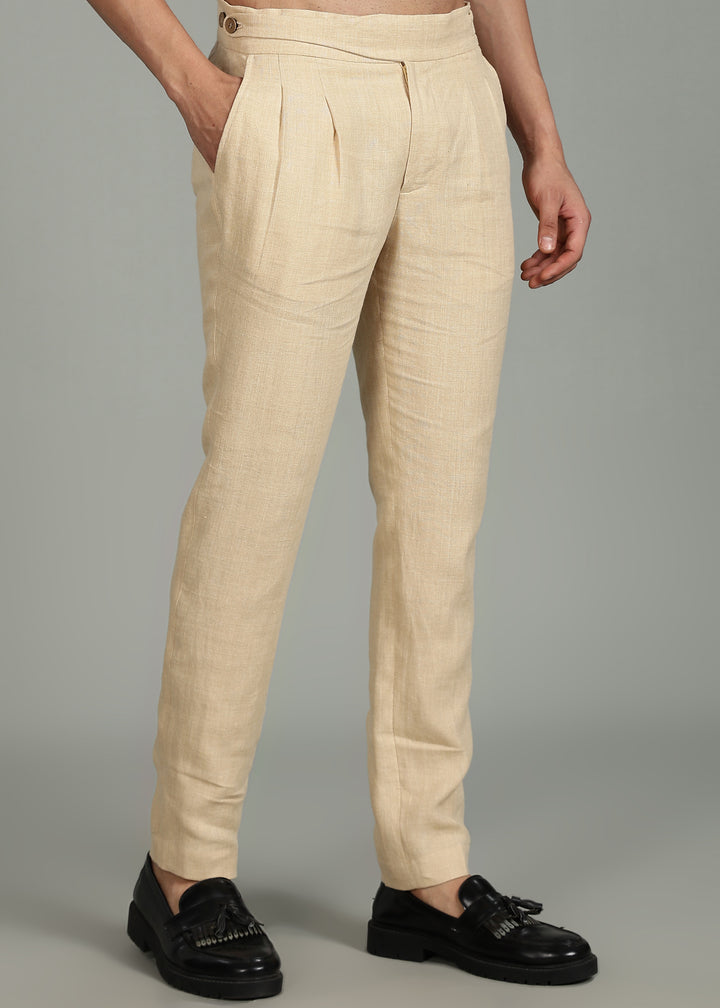 Man wearing 100% 25 LEA Capuccino Beige formal pants in an indoor grey background.