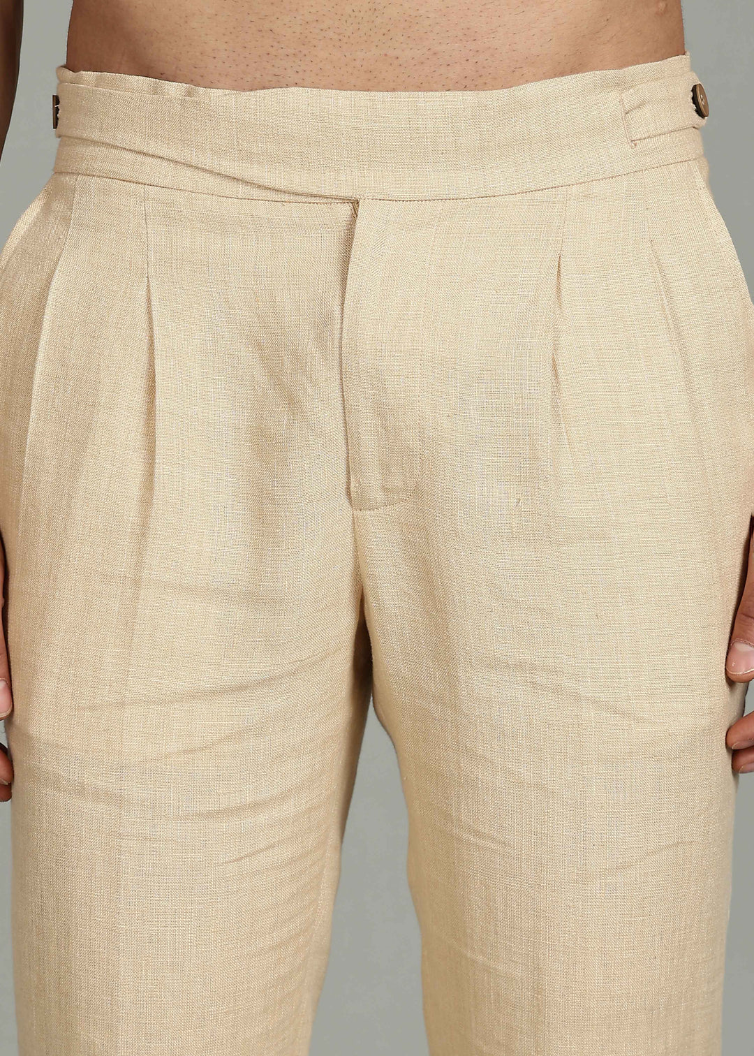 Man wearing 100% 25 LEA Capuccino Beige formal pants in an indoor grey background.