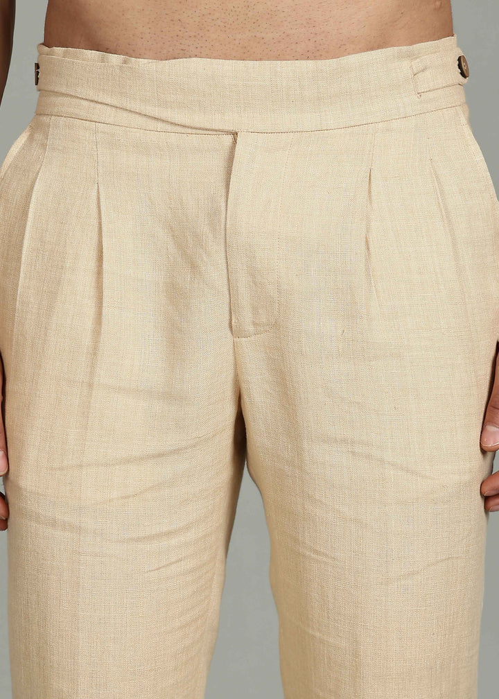 Man wearing 100% 25 LEA Capuccino Beige formal pants in an indoor grey background.