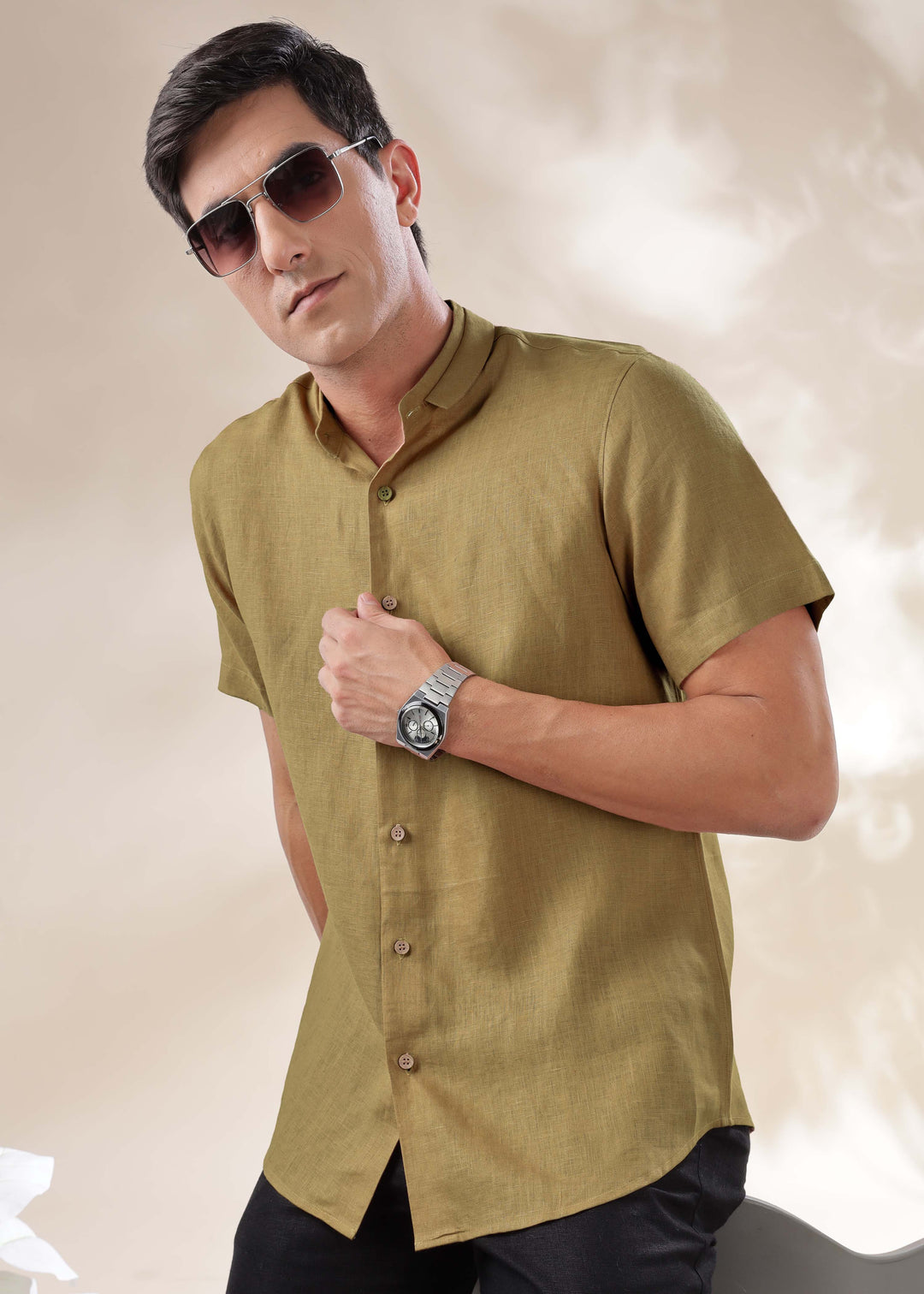 A man wearing a 100% pure linen 60 LEA sunburst yellow mandarin collar half sleeve shirt