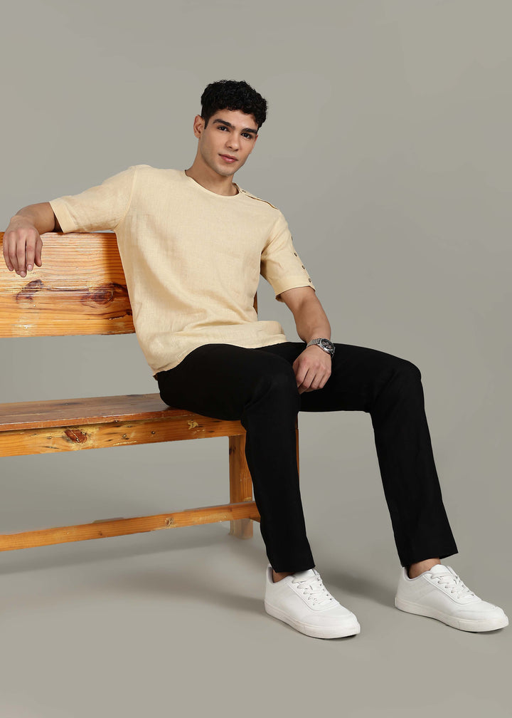 Man wearing 100% 60 LEA Light Tea Yellow Mandarin collar  T - Shirt in an indoor grey background.